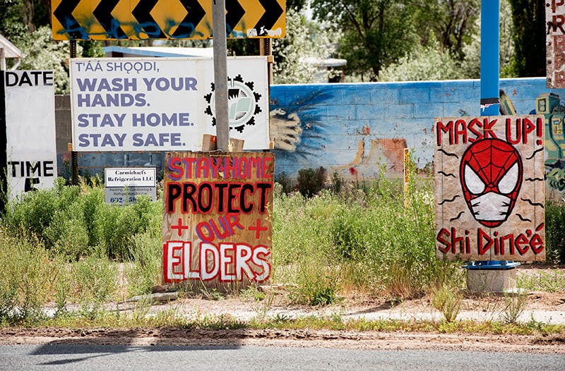 Signs encourage safety in the Navajo Nation. Photo credit: Barbara Ries / for UCSF.