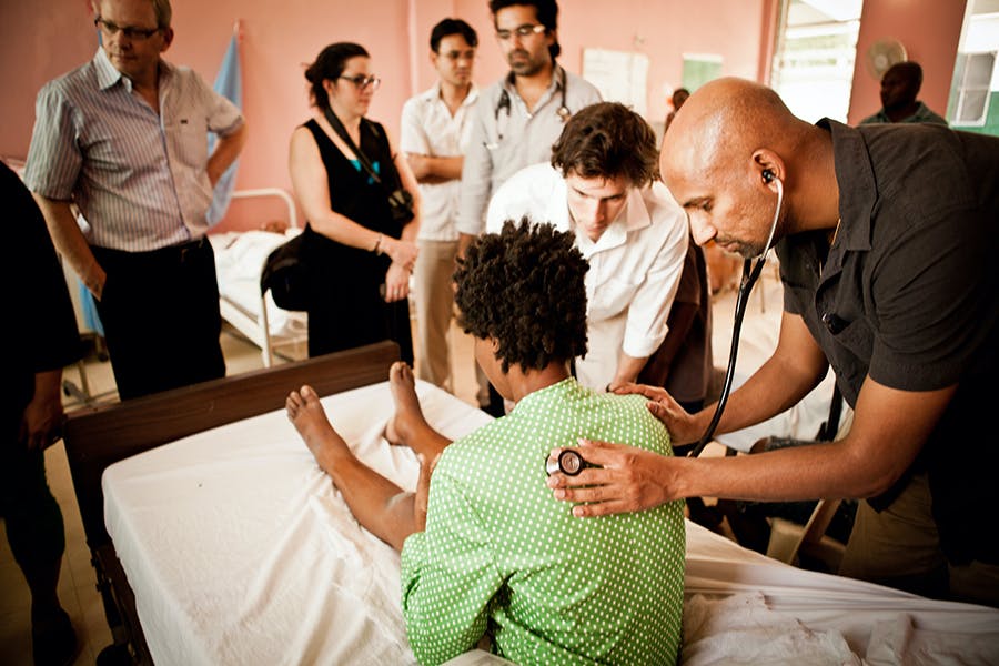 Dr. Shamasunder treating a patient in Haiti. Photo credit: Sheila Menezes