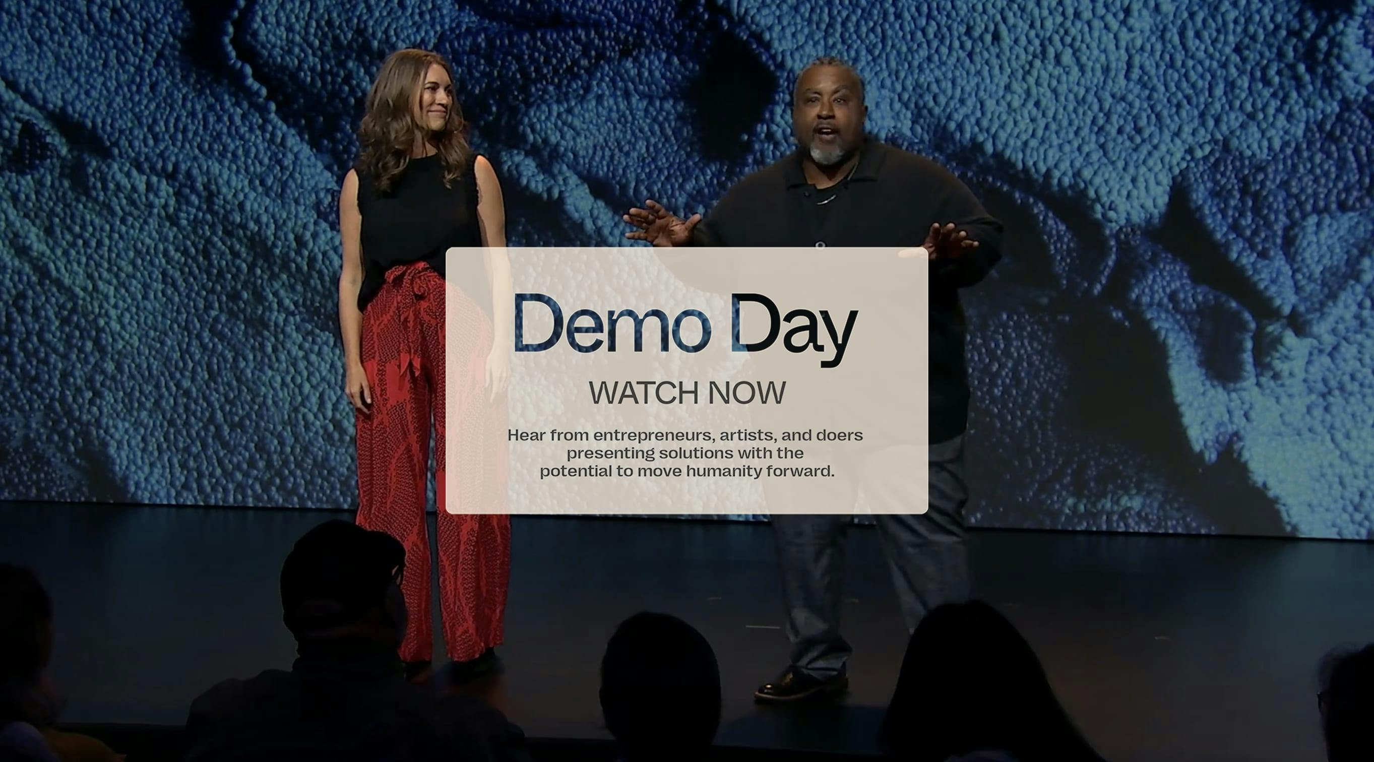Dawn Lippert and Craig Nash standing on the stage of Demo Day 2023 - Demo Day'23 Watch Now