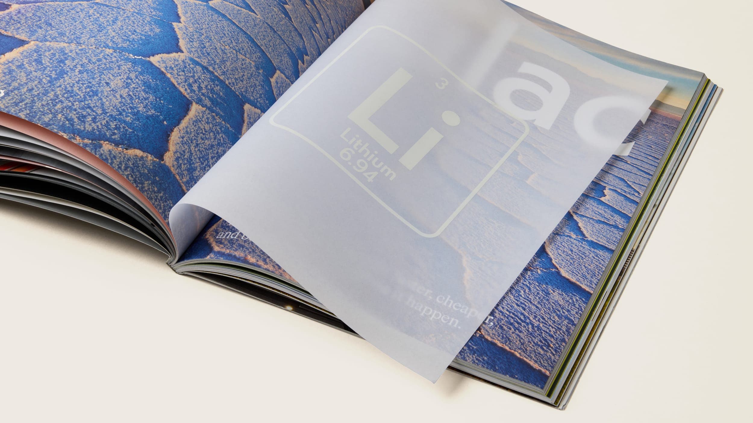 Magazine spread with opaque paper on top, Lilac is barely visible behind the top page