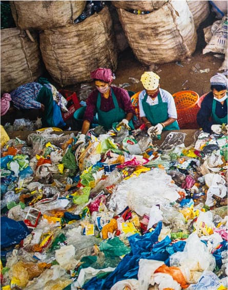 Positive Sum 1 - Single people in aprons sorting bottles